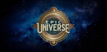 Imagem do logo do novo parque da Universal, um círculo semelhante a uma bússola sobre um céu estrelado, com as palavras "Epic Universe" no centro.