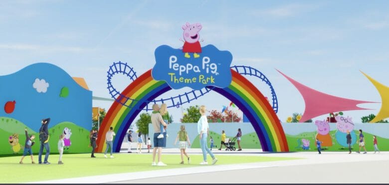 Projeto artístico do parque da Peppa Pig em Orlando, com uma placa de arco íris na entrada 